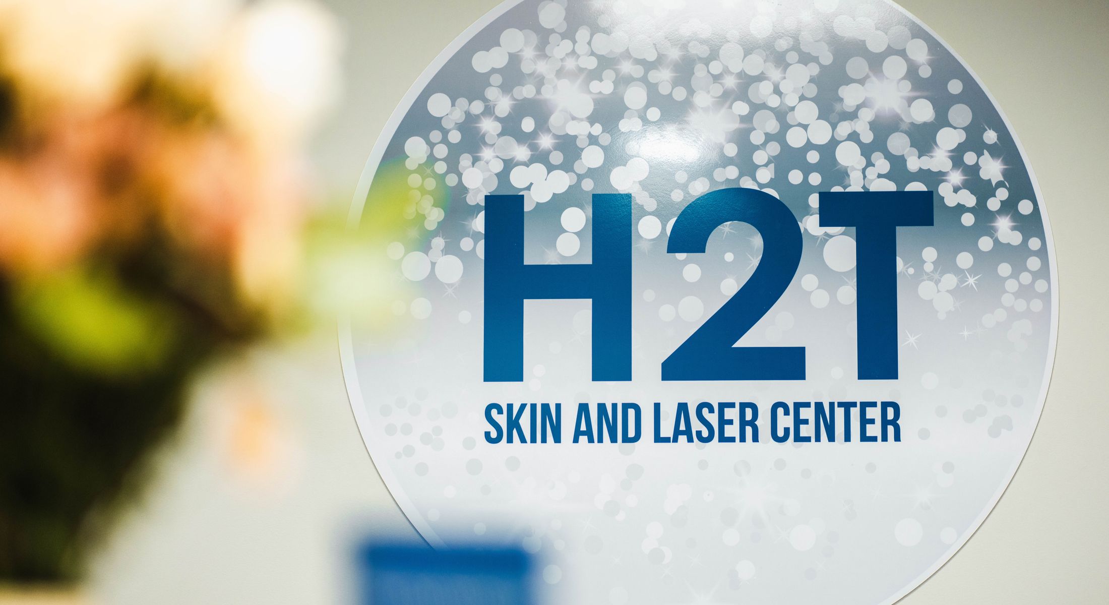 H2T Skin and Laser Center sign with blurred background