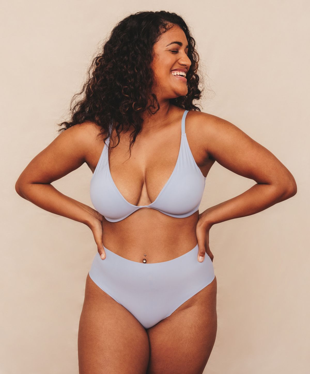 Franklin body contouring model with curly brown hair